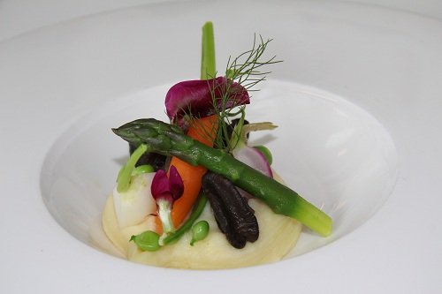 Snails with fennel and garlic cream, spring vegetables and herb emulsion